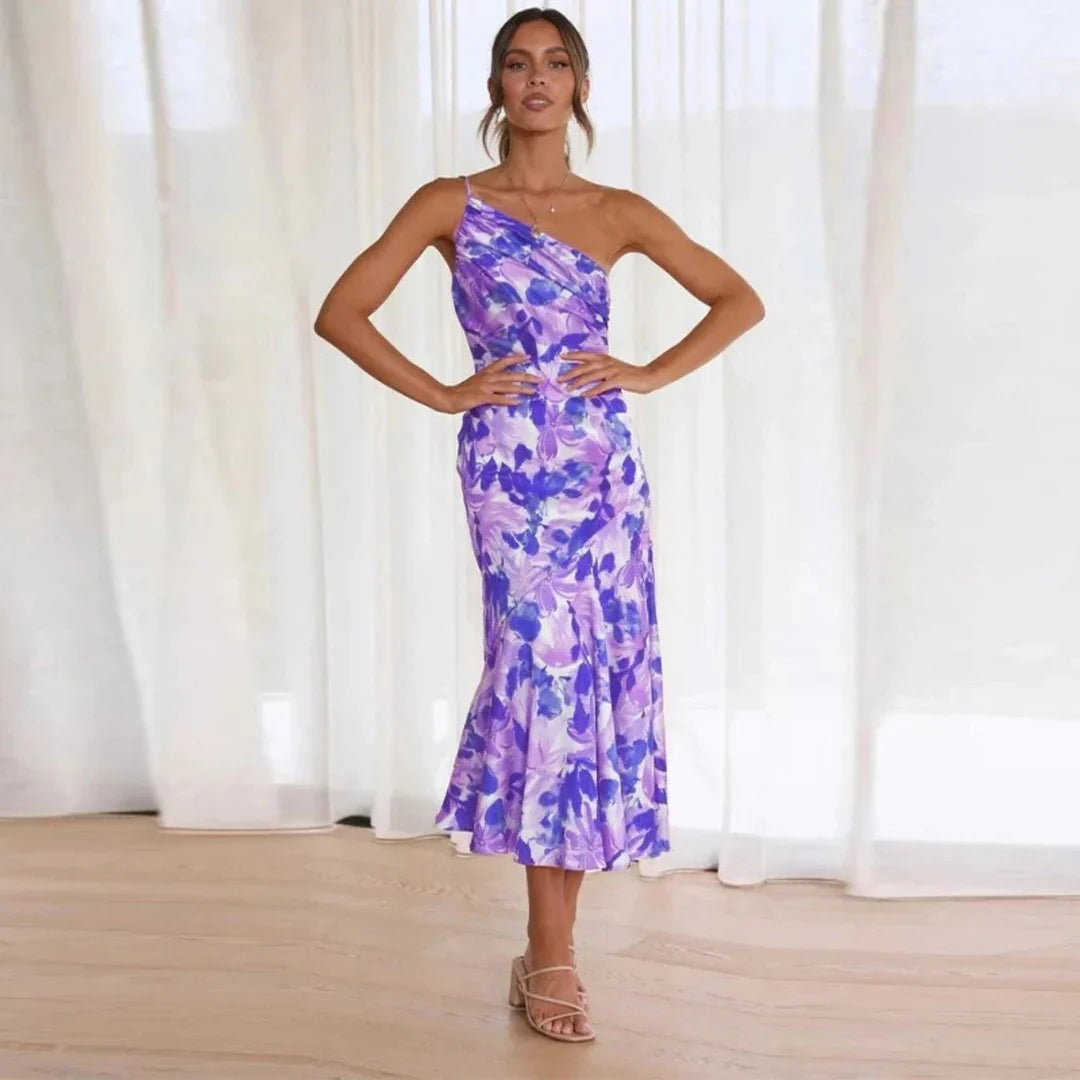 Vestido midi asimétrico con estampado floral y corte entallado