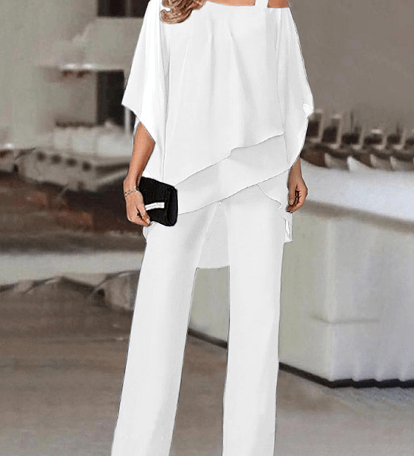Conjunto elegante de fiesta con top asimétrico y pantalón fluido