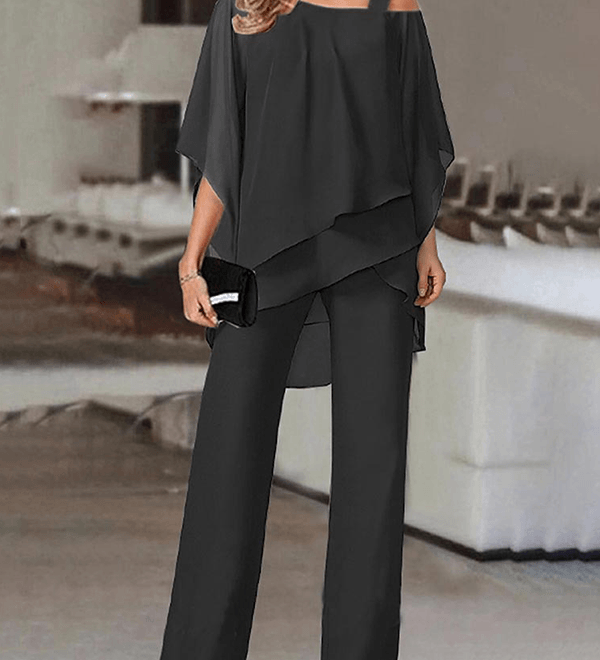 Conjunto elegante de fiesta con top asimétrico y pantalón fluido