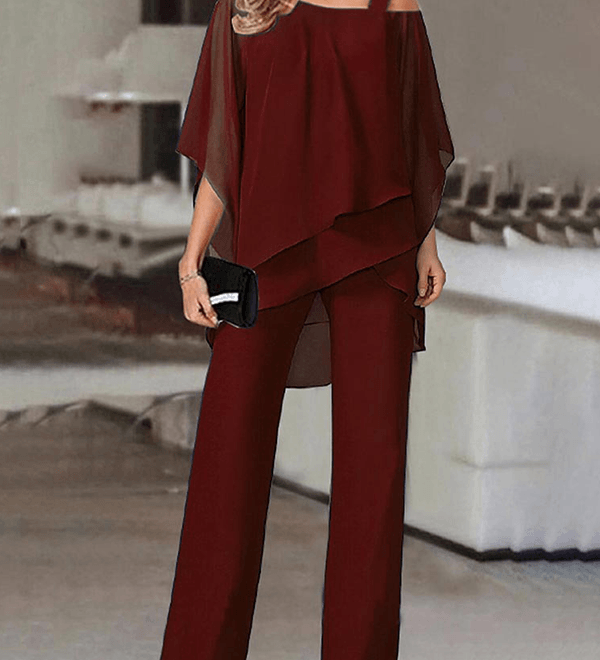 Conjunto elegante de fiesta con top asimétrico y pantalón fluido