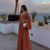 Conjunto elegante de top palabra de honor con maxi falda fluida
