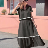 Conjunto elegante de blusa holgada con falda larga fluida