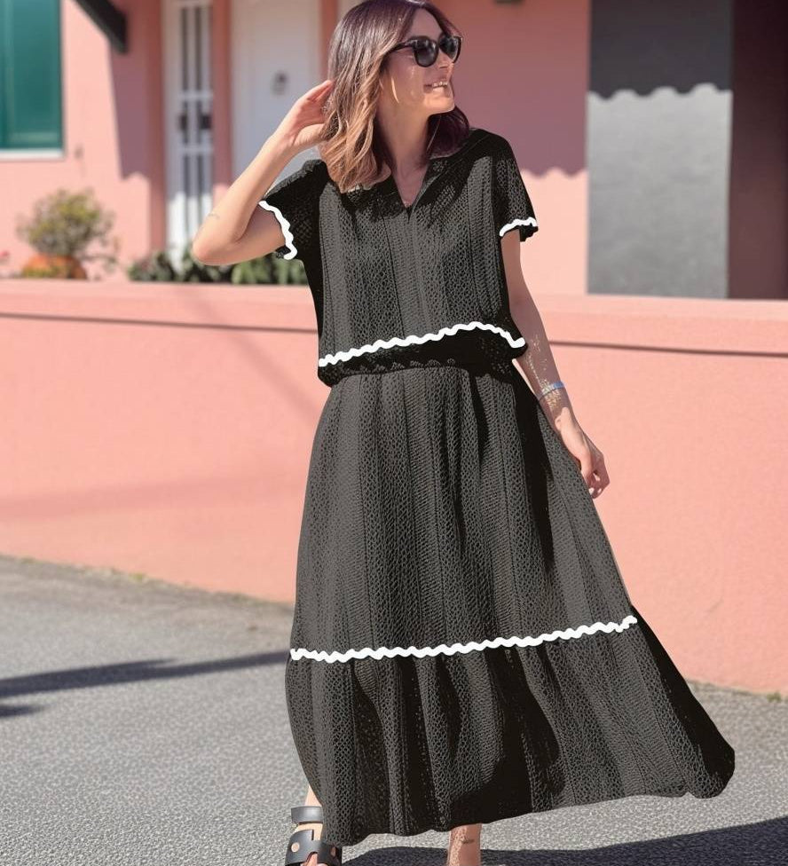 Conjunto elegante de blusa holgada con falda larga fluida