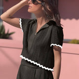 Conjunto elegante de blusa holgada con falda larga fluida
