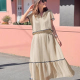 Conjunto elegante de blusa holgada con falda larga fluida