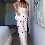 Conjunto de dos piezas con top palabra de honor y pantalón ancho de lunares