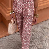 Conjunto elegante de top estampado y pantalón fluido