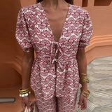 Conjunto elegante de top estampado y pantalón fluido