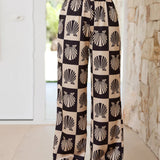 Conjunto de dos piezas con estampado de conchas marinas y estilo veraniego