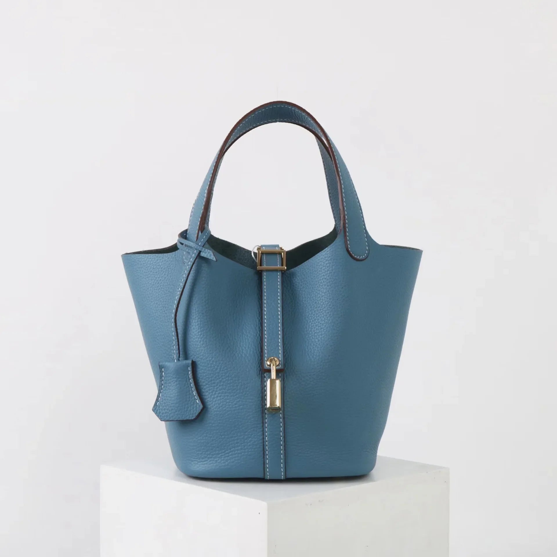 Elegant Textured Leather Bucket Bag with Gold Lock
