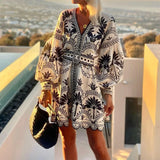 Vestido corto boho bordado con mangas abullonadas y escote en V