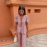 Conjunto elegante de top estampado y pantalón fluido